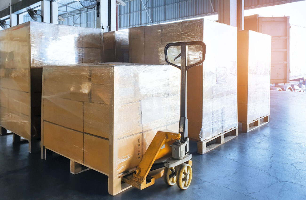 Stack cardboard boxes wrapping plastic on pallets and hand palle
